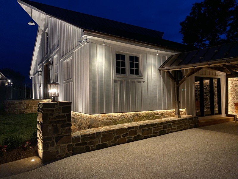 Rear of barn house with path lights