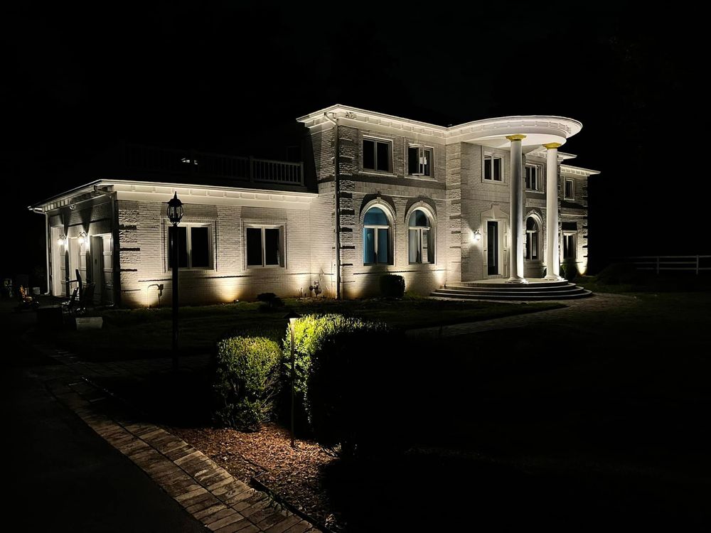 Front-quarter view of illuminated estate at night